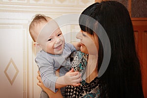 Close Up Of Mother Cuddling Newborn Baby