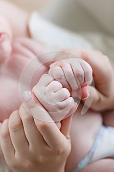 Close-up of mother and cute baby`s hands