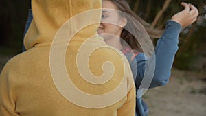 Close-up of a mother and daughter hugging.