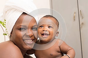 Close up of mother and happy son after bath