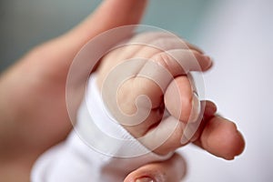 Close up of mother and newborn baby hands