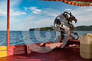 A close-up of a motor engine on a Cambodian longtail boat