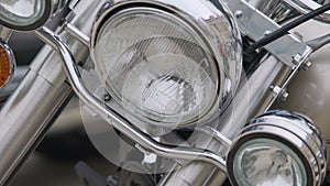 Close-up of motorbike headlight and engine, steel vehicle with plenty horsepower