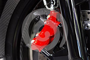 Close up motorcycle disc brake new modern red of Motorcycle, is brake system