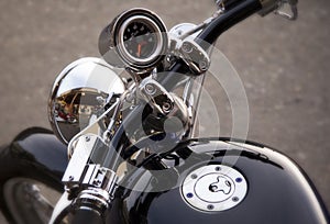 Close Up Motorcycle Headlight Gas Cap and Speedometer.