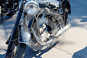 Close-up of motorcycle parked on city street