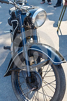 Close-up of motorcycle parked on city street