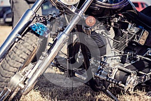 Close up of a motorcycle parked in the countryside.