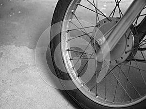 CLOSE-UP OF MOTORCYCLE SPOKES AND WHEEL