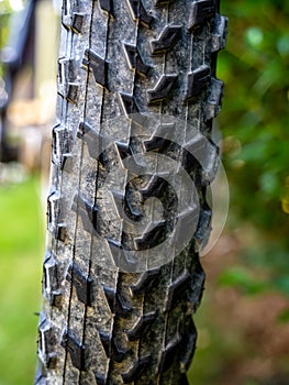 Close up of mountain bike wheel profile with dirt and natrual background