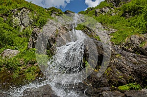 Close up mountain waterfall in Carpathians mountains.