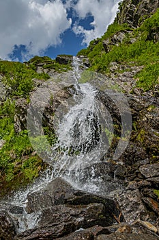 Close up mountain waterfall in Carpathians mountains.