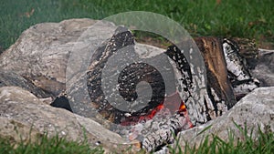 Close Up Movement of Outdoor Campfire Pit with Burning Logs