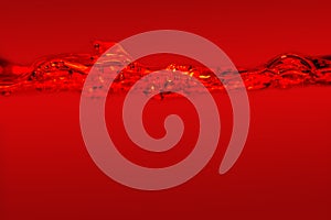 Close-up of the movement of water on a red background.
