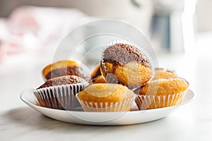 Close Up of a Muffina on plate on a white Table