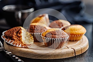 Close Up of a Muffins on cutting board on black table