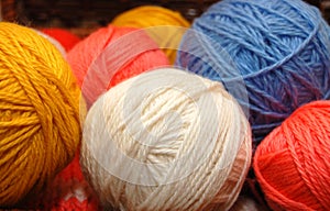 Close up on multi-coloured balls of wool
