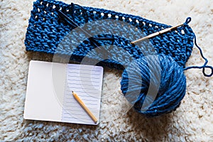 Close-up of multicolored and blue natural wool yarn balls.