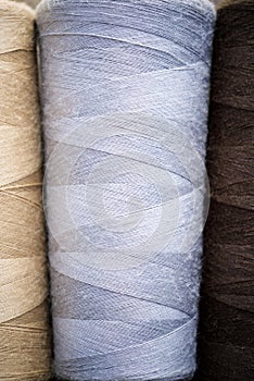 Close-up of multicolored sewing thread spools