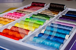 Close-up multicolored sewing threads. Multicolored background