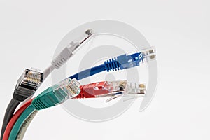 Close-up of multicoloured Ethernet networking patch leads showing detail of the plugs and sheathing.