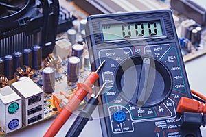 Close-up of multimeter on PCB plate