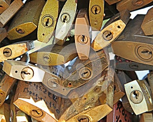 Close-up of a multitude of padlocks hung on the Pont des Arts in Paris