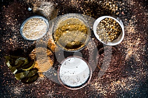 Close up of mung dal face pack with aloe vera,sandalwood,milk, and with green grams on wooden surface.