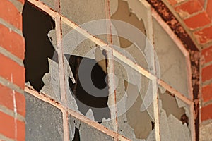 Close up of muntin window with broken glass