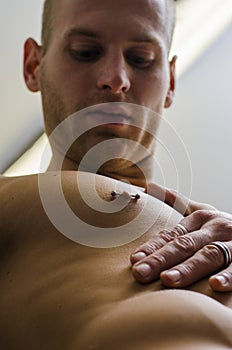 Close up of muscular male torso with nipple