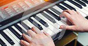 Close-up of a music performer`s hand playing the piano, man`s hand, classical music, keyboard, synthesizer, pianist