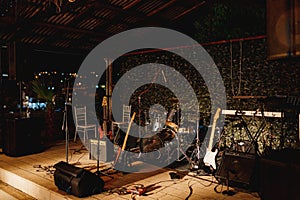 Close-up of musical instruments on stage in the evening.