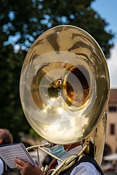 Musician of a Brass Band plays a Tuba Sousaphone - Padua Italy photo