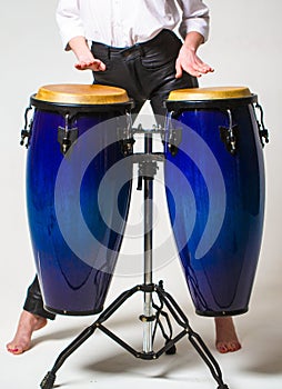 Close up of musician hand playing bongos drums. Drum. Hands of a musician playing on bongs. Performers playing bongo