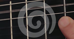 Close up of a Musician playing acoustic guitar in a recording studio