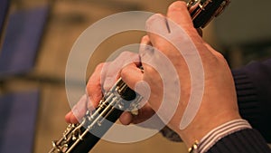 Close-up of musician playing on oboe
