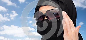 Close up of muslim woman in hijab and sunglasses
