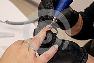 Close-up of nail and cuticle treatment by the apparatus