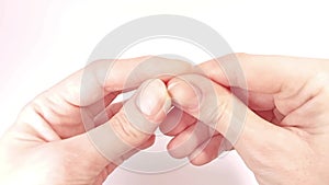 Close-up of nails on woman\'s hand at the white background