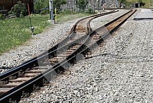 Close up of a narrow gauge railroad track switch