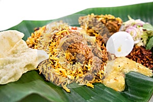 Close-up on nasi briyani with lambserved on banana leaf