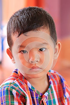 Close-up in native dress of asian boy