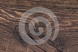 Close-up of a natural board with the place of growth of the knot. Texture of a picturesque fibrous wood for design works on a