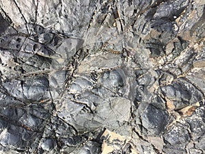 Close-up natural textured of black rock surface