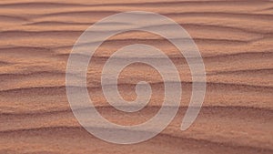 Close-up of nature sand dunes in red desert in United Arab Emirates.