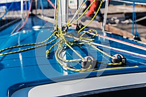 Close-up nautical knot rope tied around stake on boat or ship, boat mooring rope.
