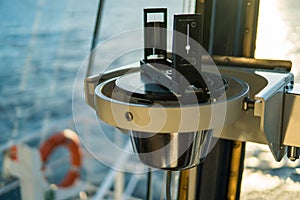 Close up of nautical marine magnetic compass on yacht or boat