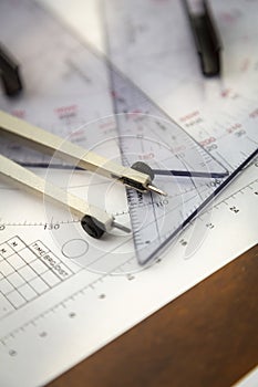 Close up of a navigator\'s radar plotting chart with a triangle and compass divider