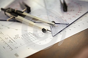 Close up of a navigator\'s radar plotting chart with a triangle and compass divider