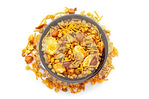 Close-up of Navratan Indian namkeen (snacks) on a ceramic black bowl.